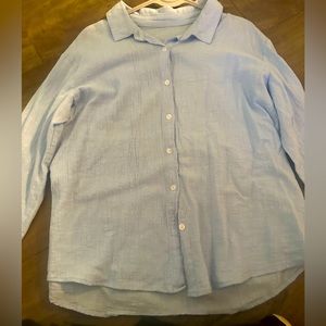 Woman’s light blue light material button down shirt casual lightly used . Large